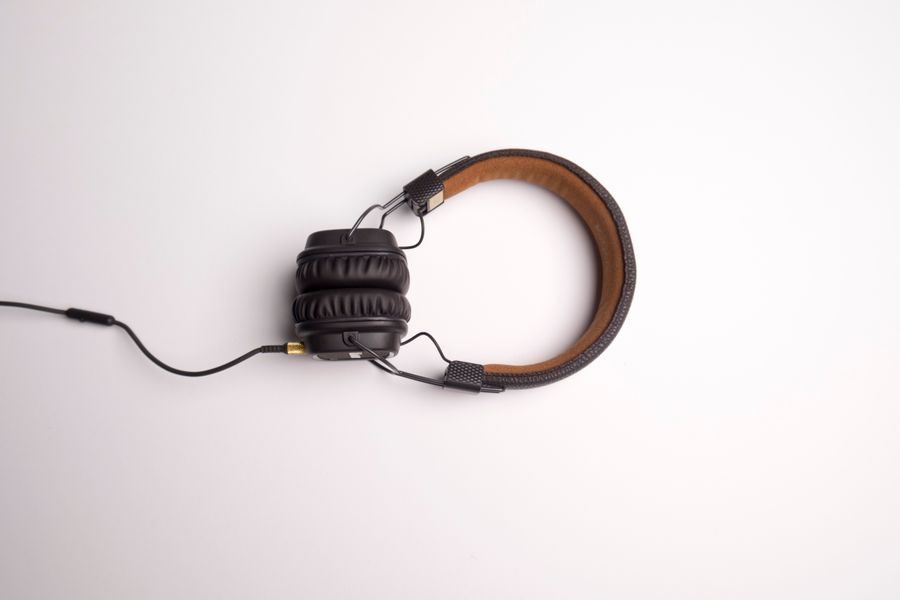 Over-ear headphones resting on a plain background