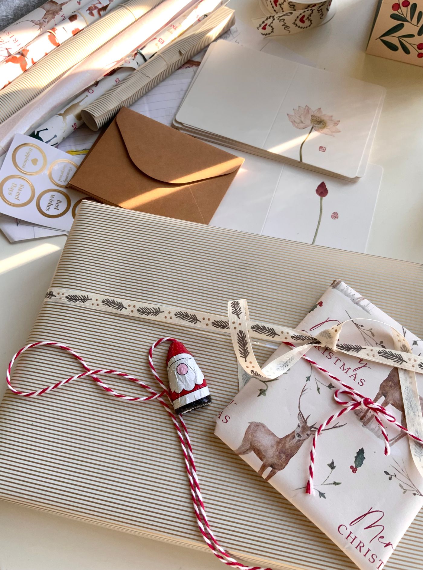 Wrapping Christmas gifts in warm sunlight